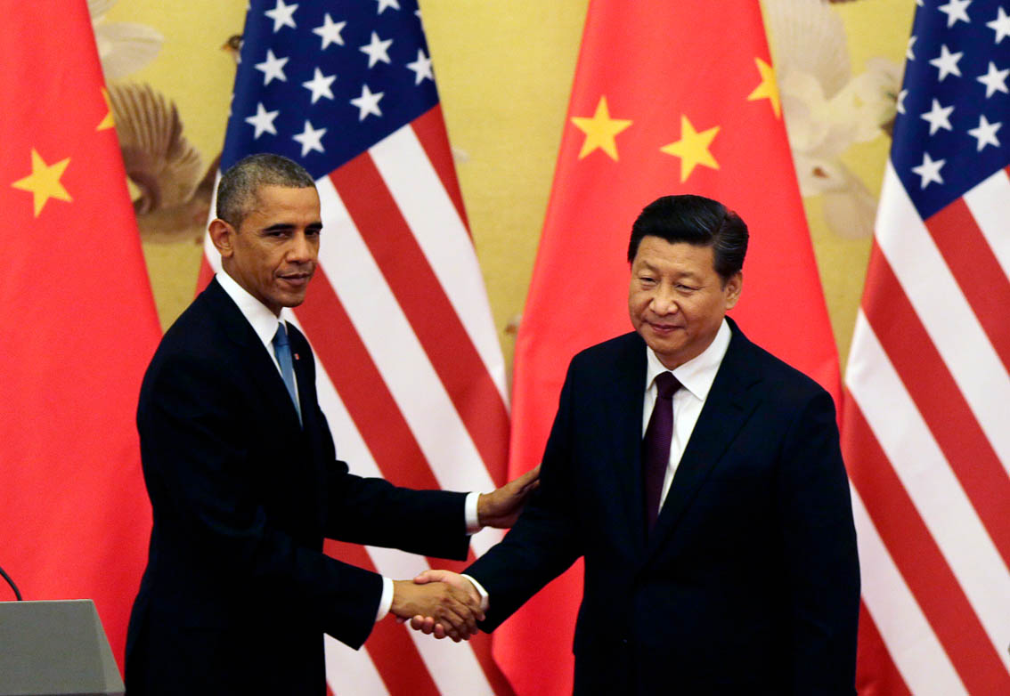 President Barack Obama shakes hand with Chinese President Xi Jinping after their press conference at the Great Hall of the People in Beijing, China on Nov. 12, 2014.