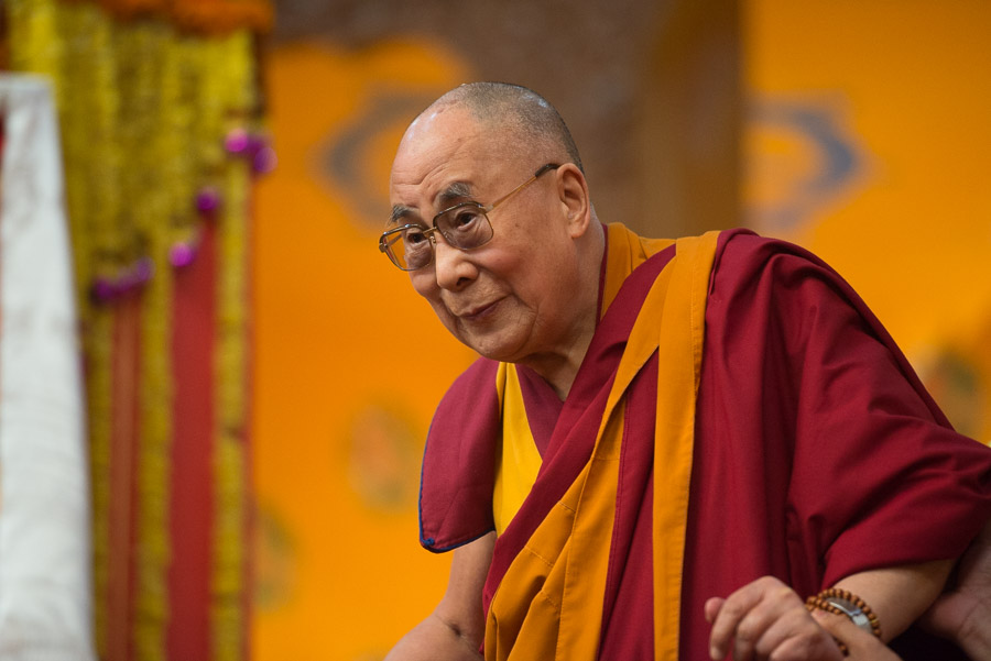 His Holiness the Dalai Lama looking out over the audience on his arrival at Tashi Lhunpo Monastery's Assembly Hall in Bylakuppe, Karnataka, India on January 1, 2016. (Photo courtesy/Tenzin Choejor/OHHDL)