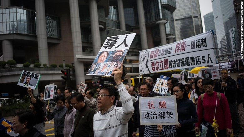 Thousands of people march through central Hong Kong Sunday, January 10, protesting the disappearance of a number of publishers and booksellers. (Photo courtesy: CNN)
