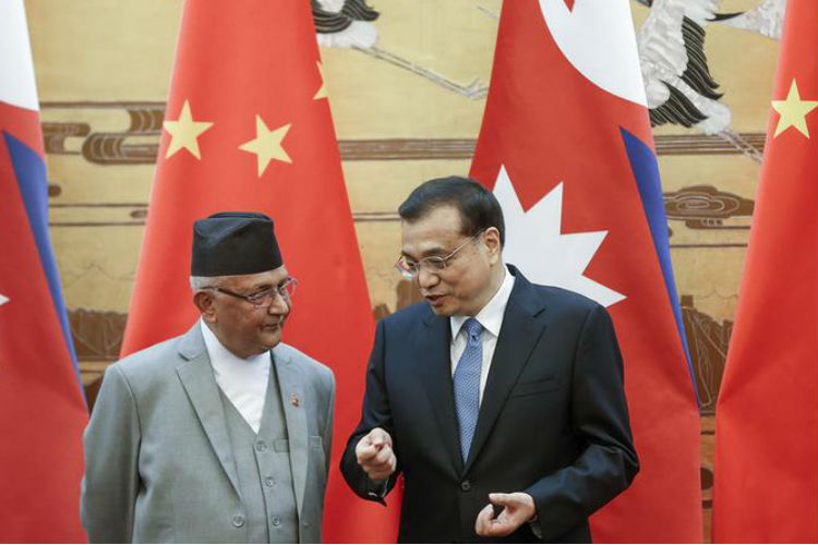 Chinese Premier Li Keqiang (R) with Nepal Prime Minister K.P. Sharma Oli during a signing ceremony at the Great Hall of the People in Beijing on March 21, 2016 (Photo courtesy:AFP)