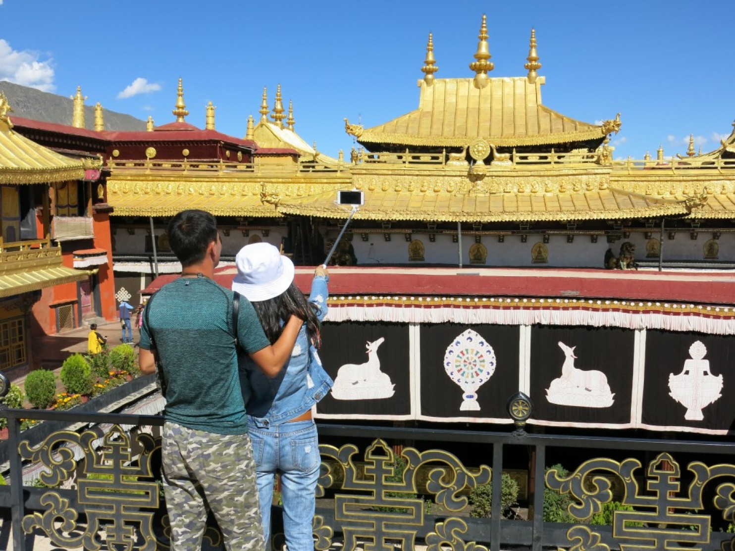 Tourists take a selfie at Jokhang Temple in Lhasa, China. (Photo courtesy/Simon Denyer/The Washington Post)