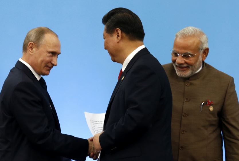Russian President Vladimir Putin, Indian Prime Minister Narendra Modi and Chinese President Xi Jinping. 