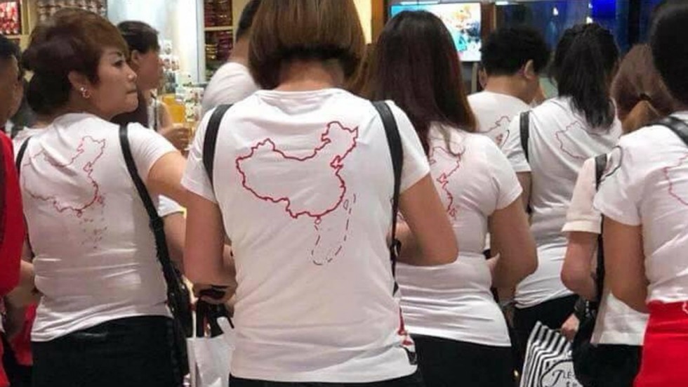 A photo of Chinese tourists wearing T-shirts depicting Beijing’s claims to the disputed South China Sea has sparked online anger in Vietnam, prompting calls for the visitors to be deported. (Photo courtesy: AFP)