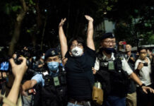 Six held as many in Hong Kong held subdued individual commemorations of Tiananmen massacre