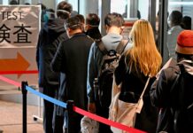 China retaliates by suspending visas to Japan, S Korea; claims country is past Covid peak; experts say worst yet to come