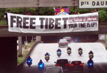‘Free Tibet’ banner greets President Xi Jinping on arrival in Paris for state visit