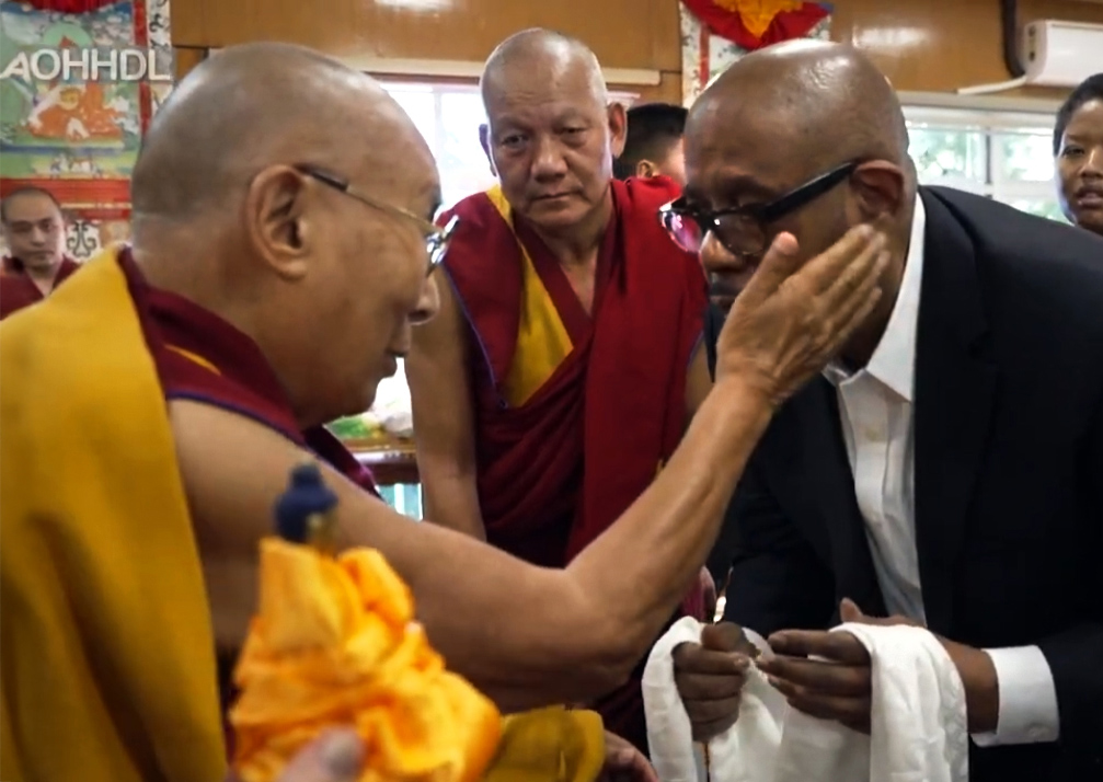 Hollywood star Whitaker, well known for his charity work, visits Dalai Lama