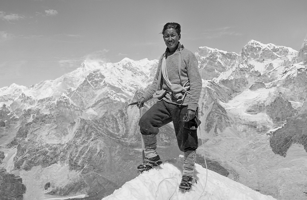 Tenzing Norgay, a Tibetan outsider who summits Mt Everest, wins Sherpa respect